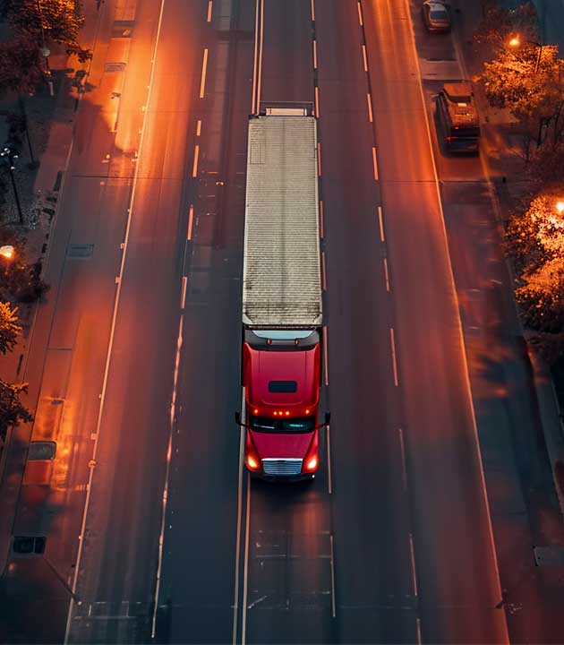 Truck moving on a highway at sunset
